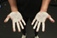 liquid chalk applied on hands before lifting